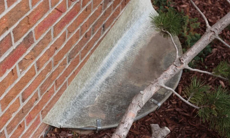 Basement egress window well at a home
