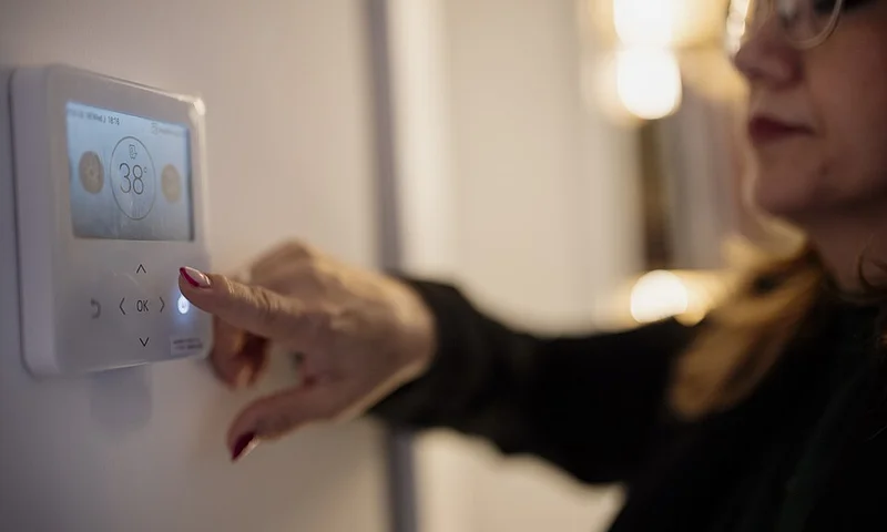 Smart home thermostat on an interior wall